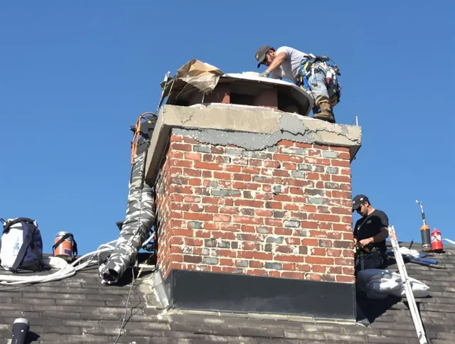 The Villages Chimney Sweep installing a custom chimney crown in The Villages, FL