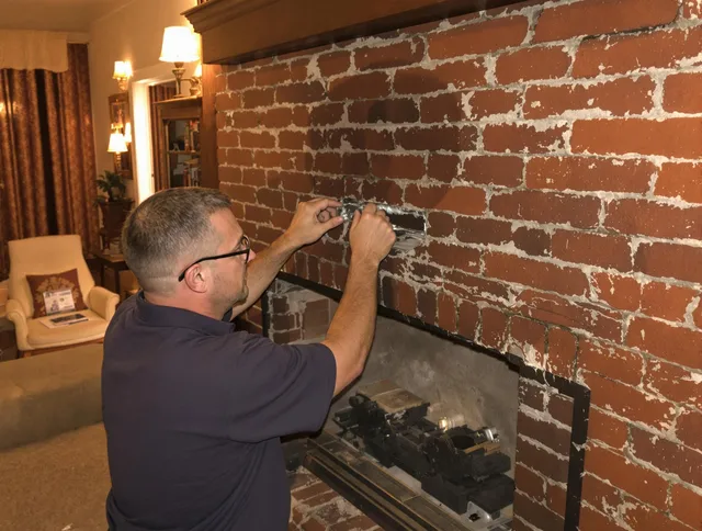 The Villages Chimney Sweep expert fixing a fireplace in The Villages, FL